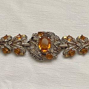 Vintage costume bracelet with amber colored stones.